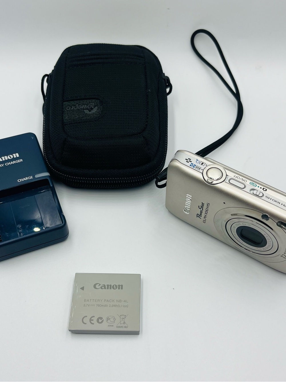 Canon PowerShot ELPH 100 HS 12.1MP Digital Camera Silver + Charger & Case